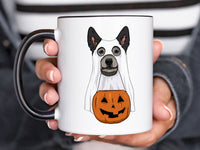 Hand holding an 11 oz hey boo halloween ceramic mug blue heeler ghost dog