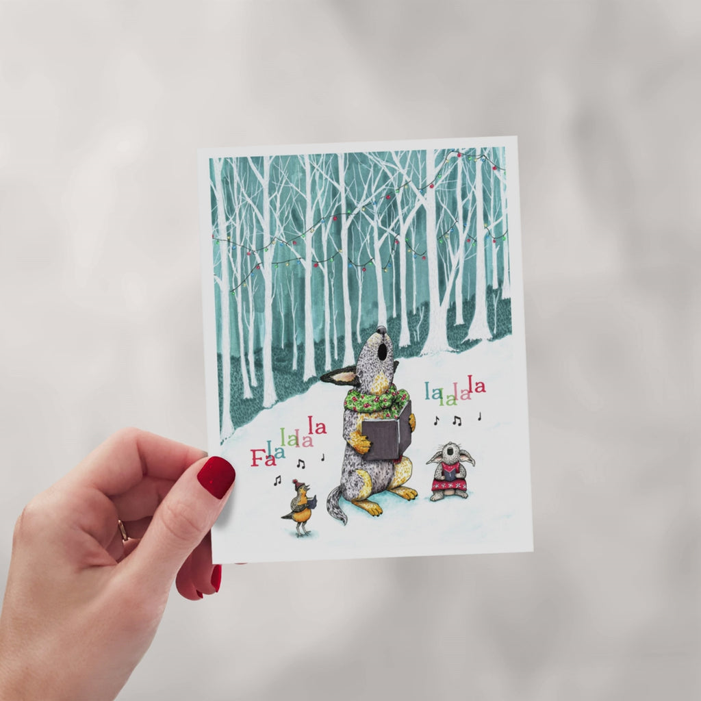 A set of eight assorted Christmas cards featuring red heeler cattle dogs in playful holiday scenes with festive costumes, snow, lights, and greenery.